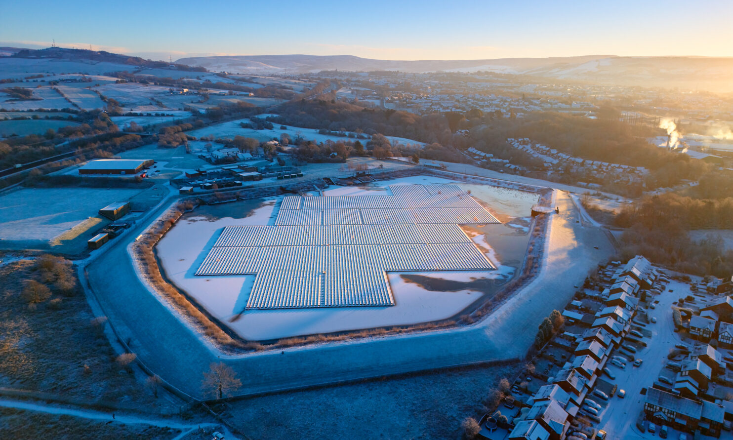 Aerial view of Godley reservoir on a cold and frost morning