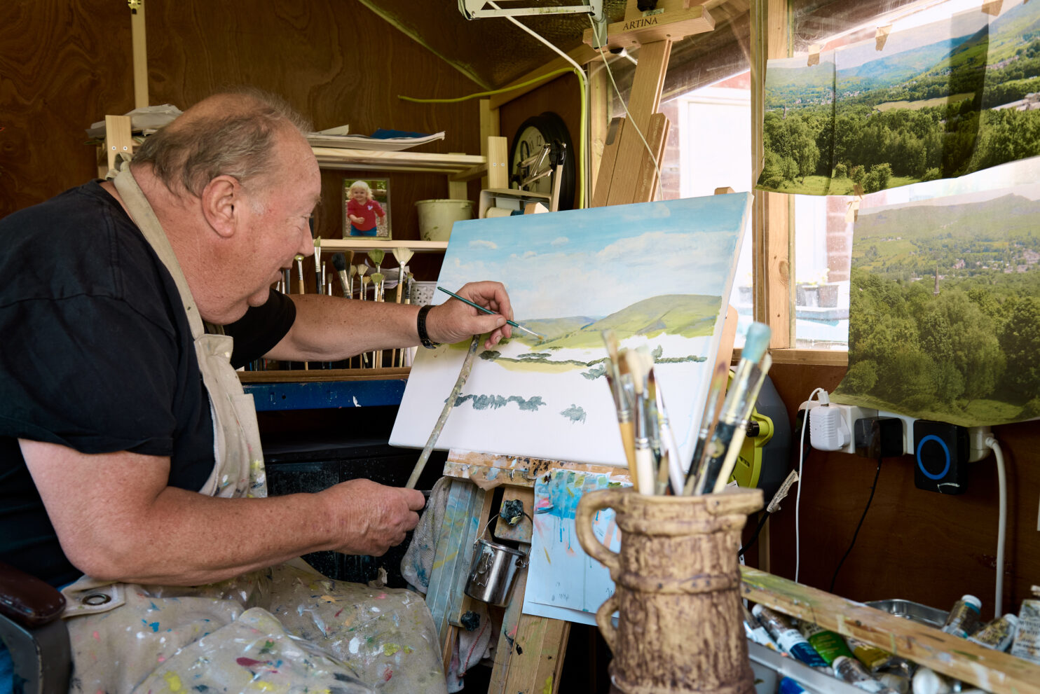 artist Rob Lees from Royton paints in his home studio